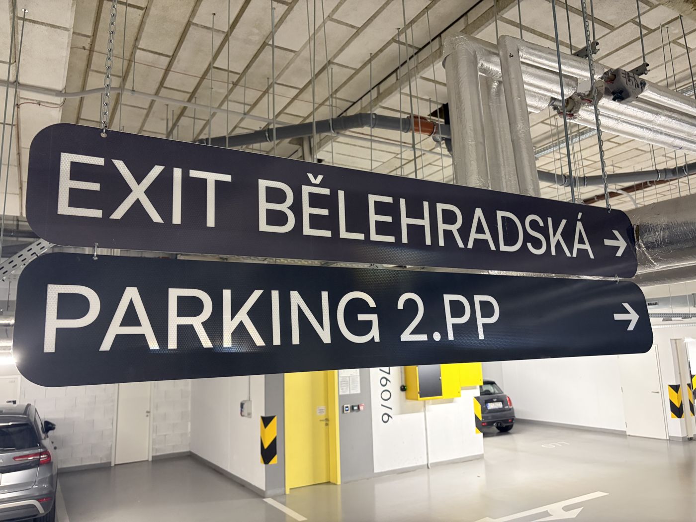 The ramp takes you down to level −1. Follow the PARKING 2.PP signs to the next r